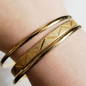 Vintage bangle bracelets one engraved zig zag two smooth gold tone